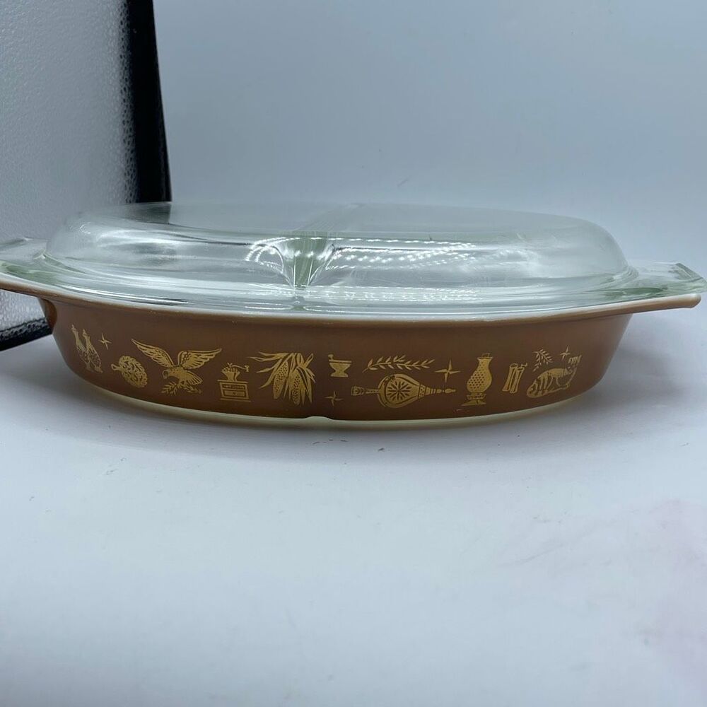 Vintage Pyrex Early American 1-1/2 quart divided casserole dish with lid.